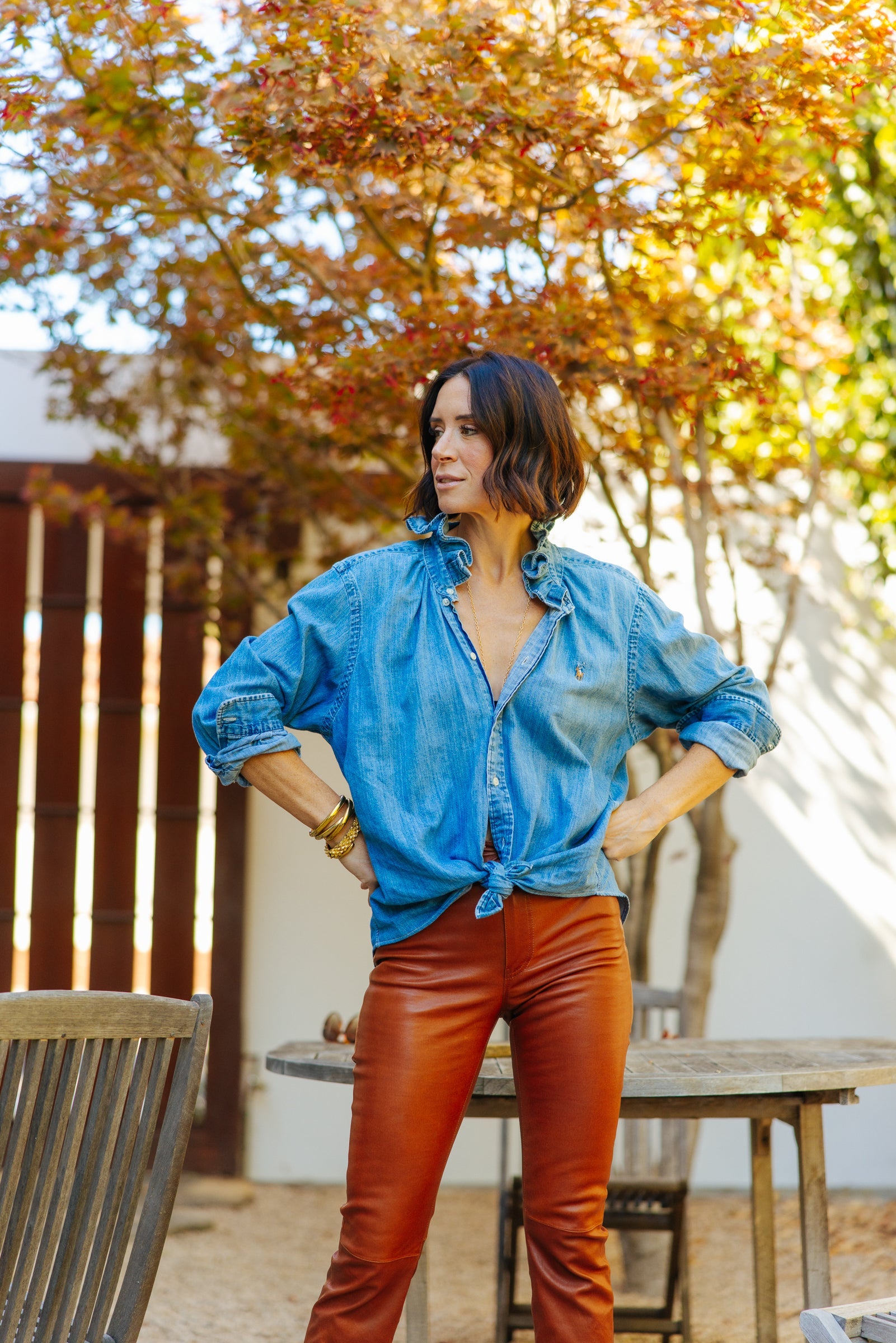 Model in a light pink Southern Lover shirt with pink flower background